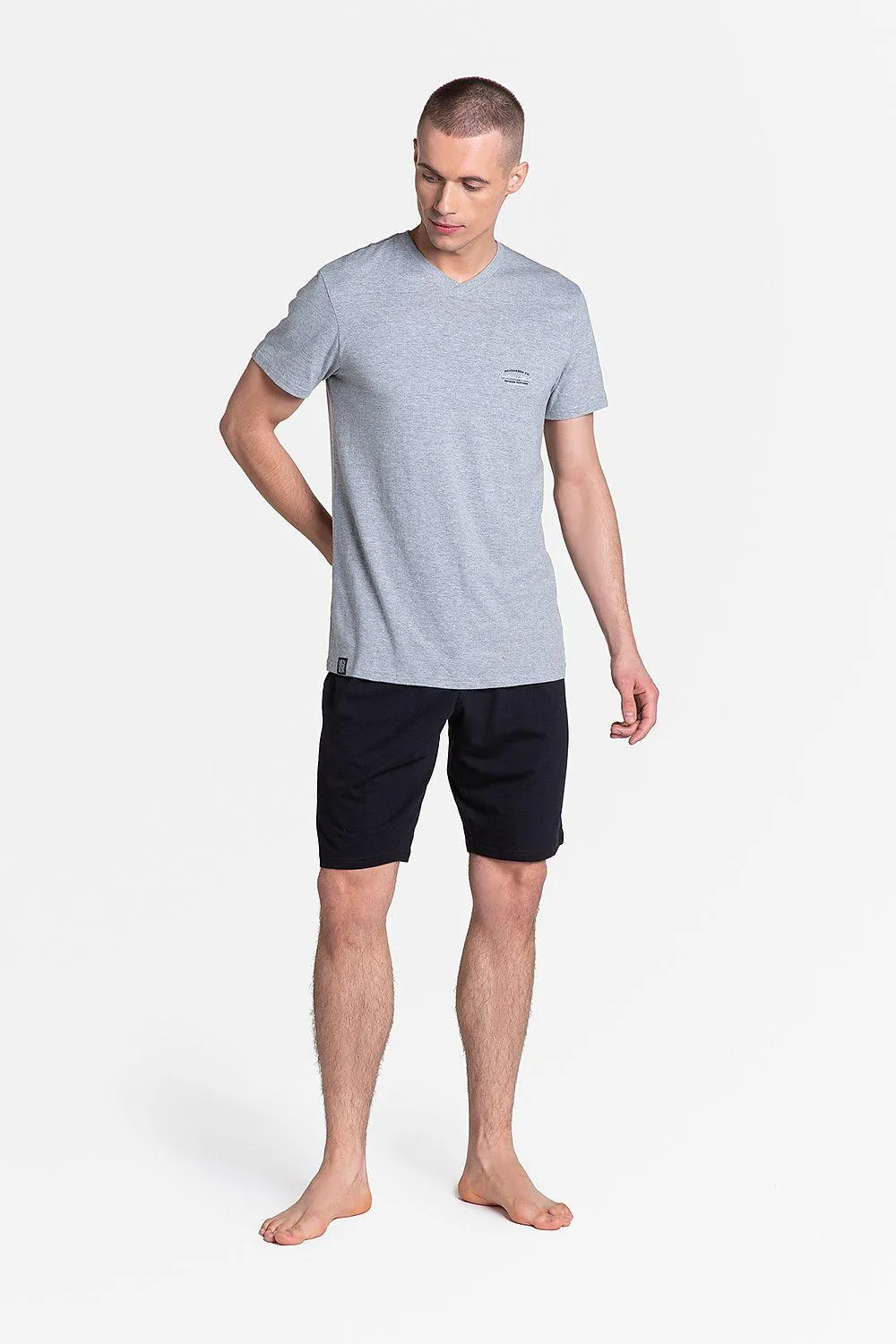 Henderson t-shirt and black trousers